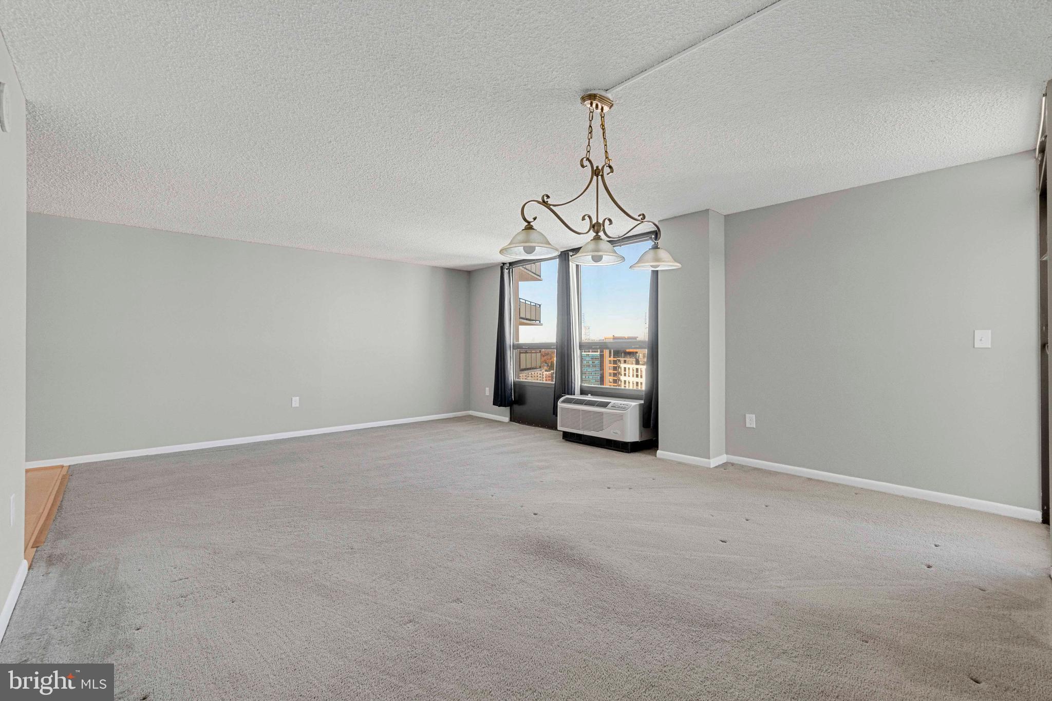 205 East Joppa Road, Unit 1902 Towson, MD 21286 - Photo 8 of 27 a view of a room with windows and ceiling fan
