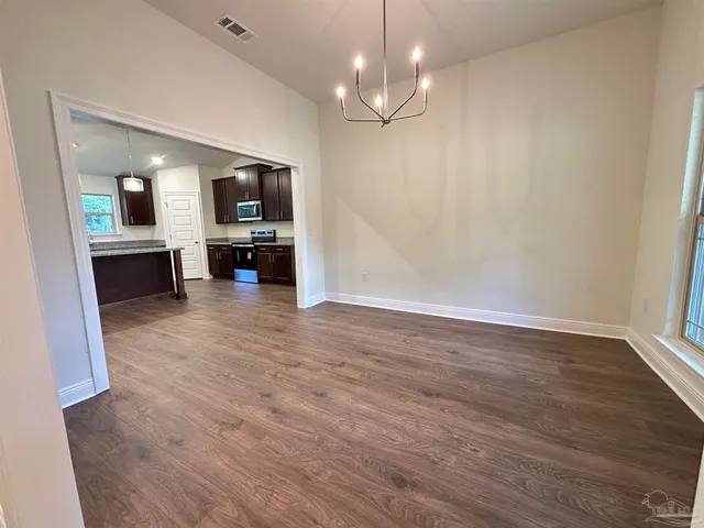 a kitchen with kitchen island granite countertop a large counter top and sink