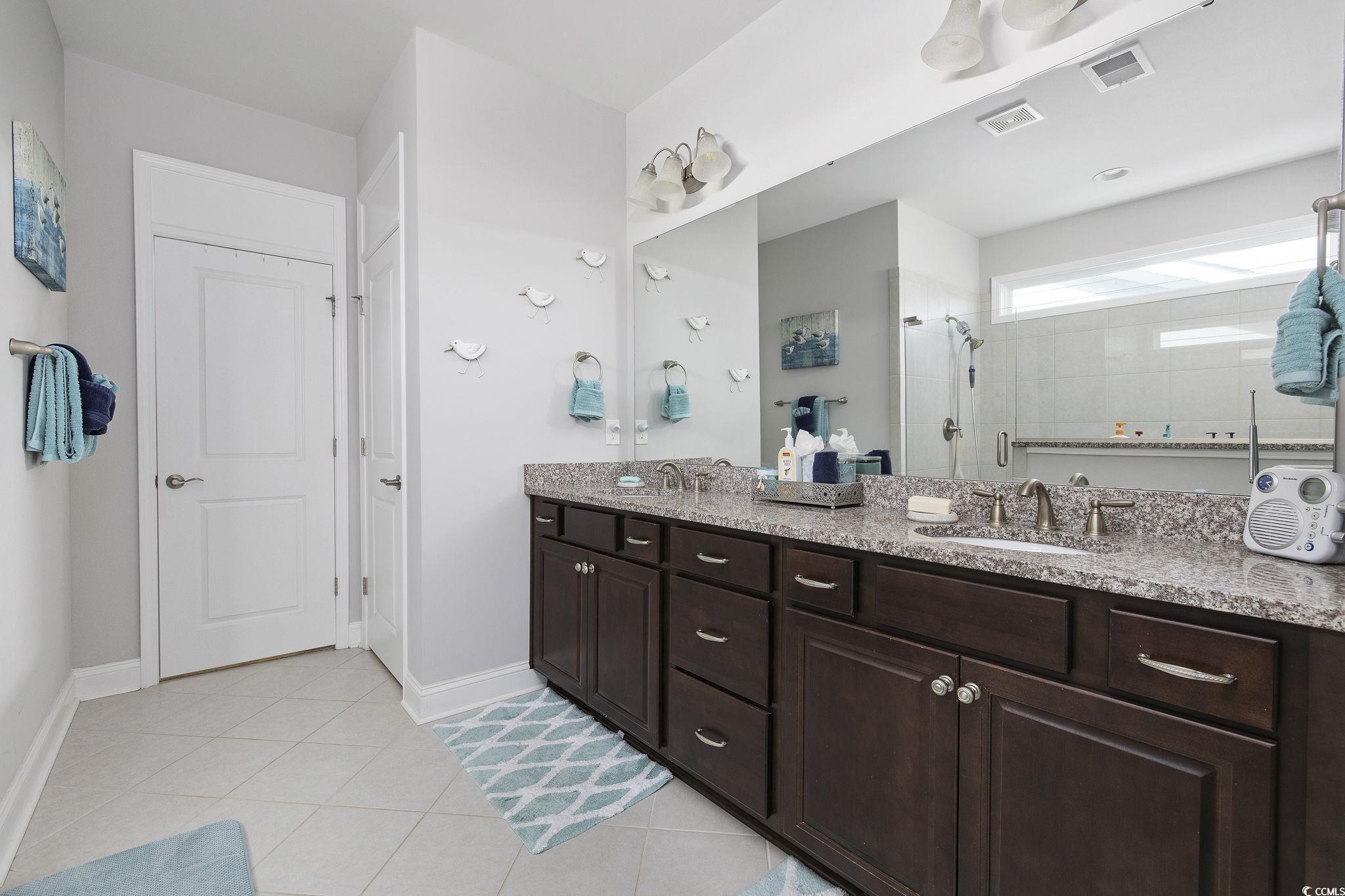1906 Silver Spring Lane Myrtle Beach, SC 29577 - Photo 16 of 40 Bathroom featuring tile patterned floors, walk in
