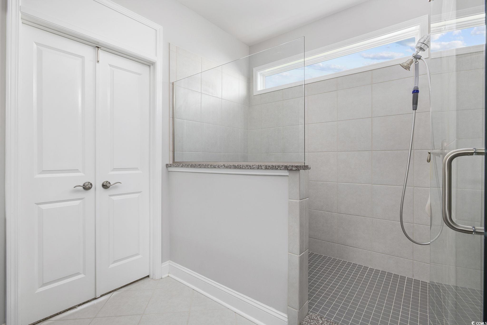 1906 Silver Spring Lane Myrtle Beach, SC 29577 - Photo 17 of 40 Bathroom featuring tile patterned floors and a sho