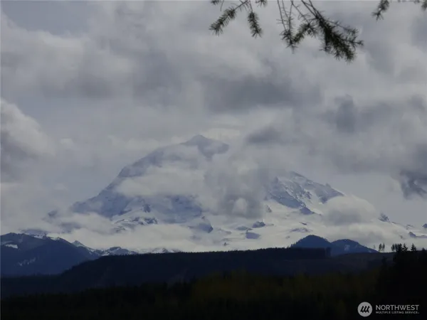 a view of a wooden floor and a ceiling fan