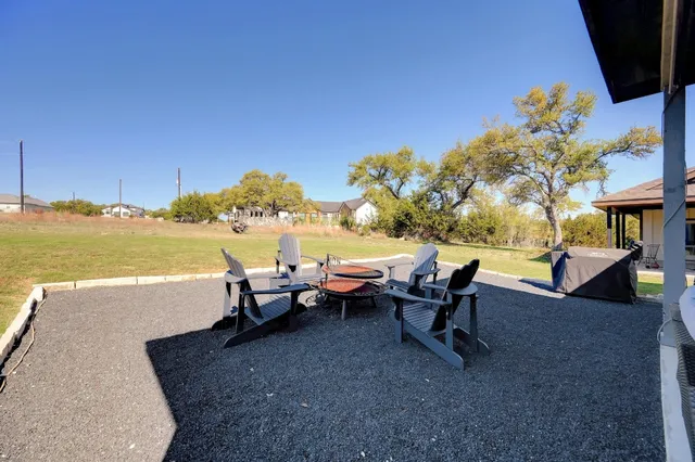 a outdoor space with patio the couches and a dining table with the view of the garden