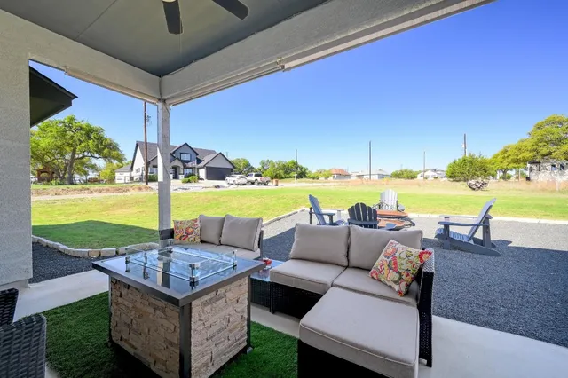 a view of a table and chairs in the patio