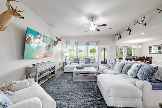 a living room with furniture and a large window