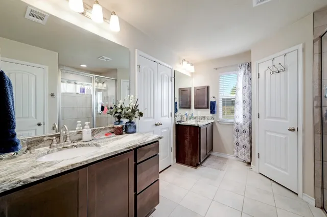 a bedroom with furniture and a wooden floor