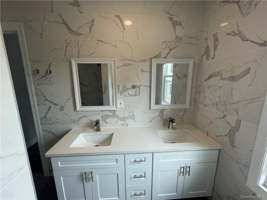 33 Park Avenue New Rochelle, NY 10805 - Photo 2 of 12 a bathroom with a sink and a mirror