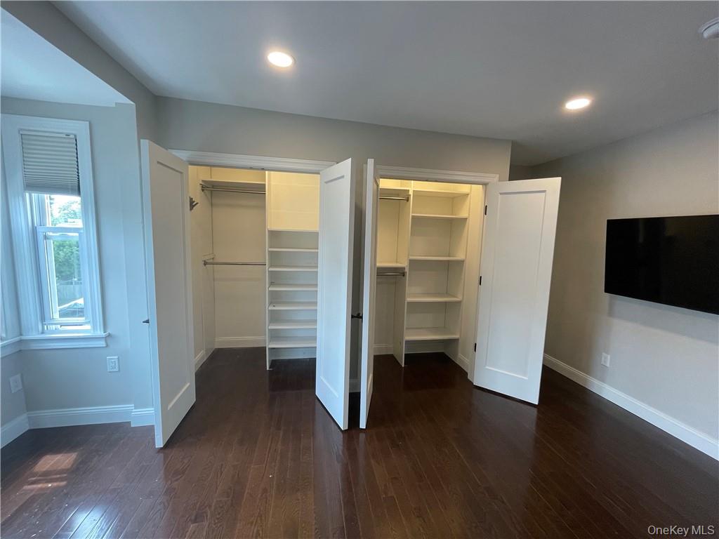 33 Park Avenue New Rochelle, NY 10805 - Photo 4 of 12 wooden floor in an empty room with a window