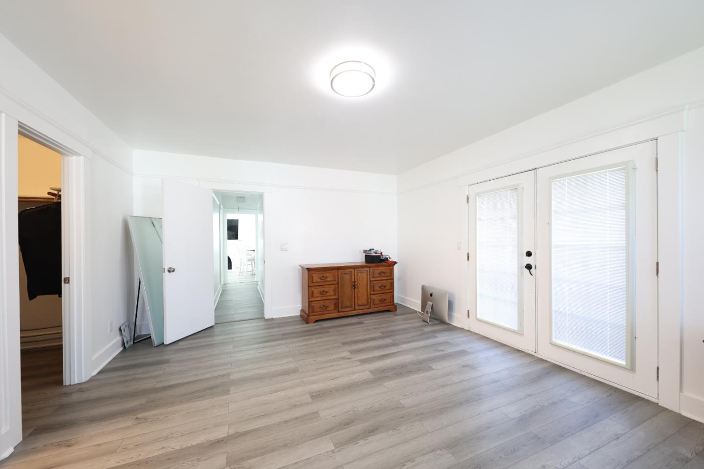 123 Chestnut Street Salinas, CA 93901 - Photo 18 of 25 an empty room with wooden floor and window