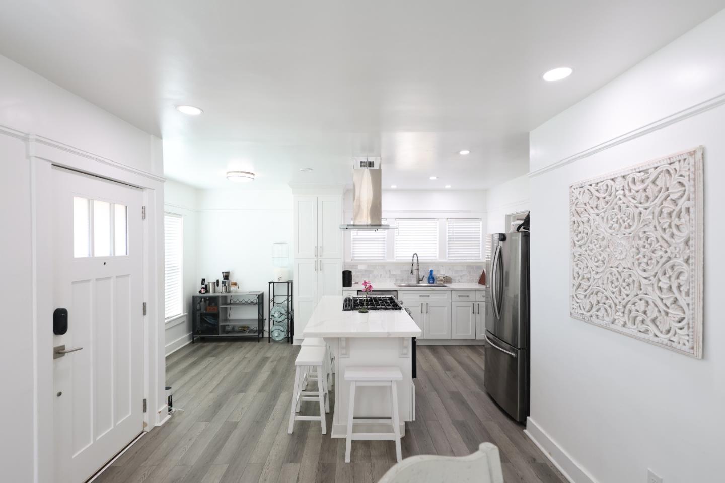 123 Chestnut Street Salinas, CA 93901 - Photo 4 of 25 a kitchen with a refrigerator and wooden floor