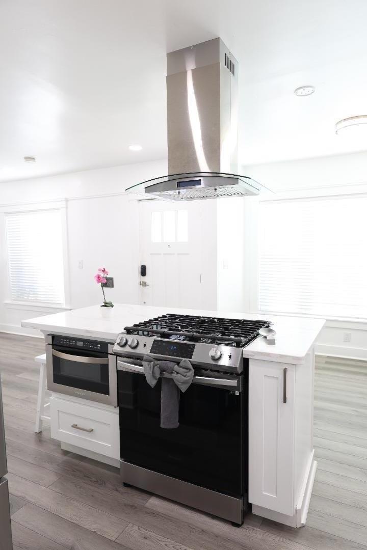 123 Chestnut Street Salinas, CA 93901 - Photo 6 of 25 a white stove top oven sitting inside of a kitchen