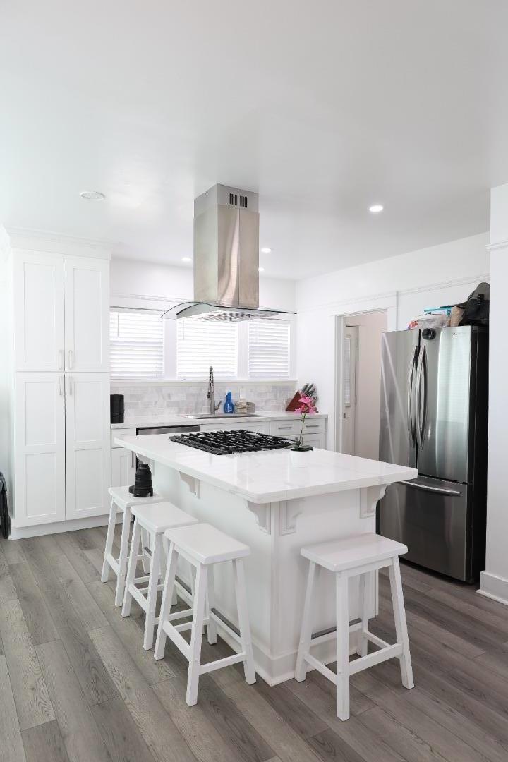 123 Chestnut Street Salinas, CA 93901 - Photo 7 of 25 a kitchen with a dining table chairs and stainless steel appliances