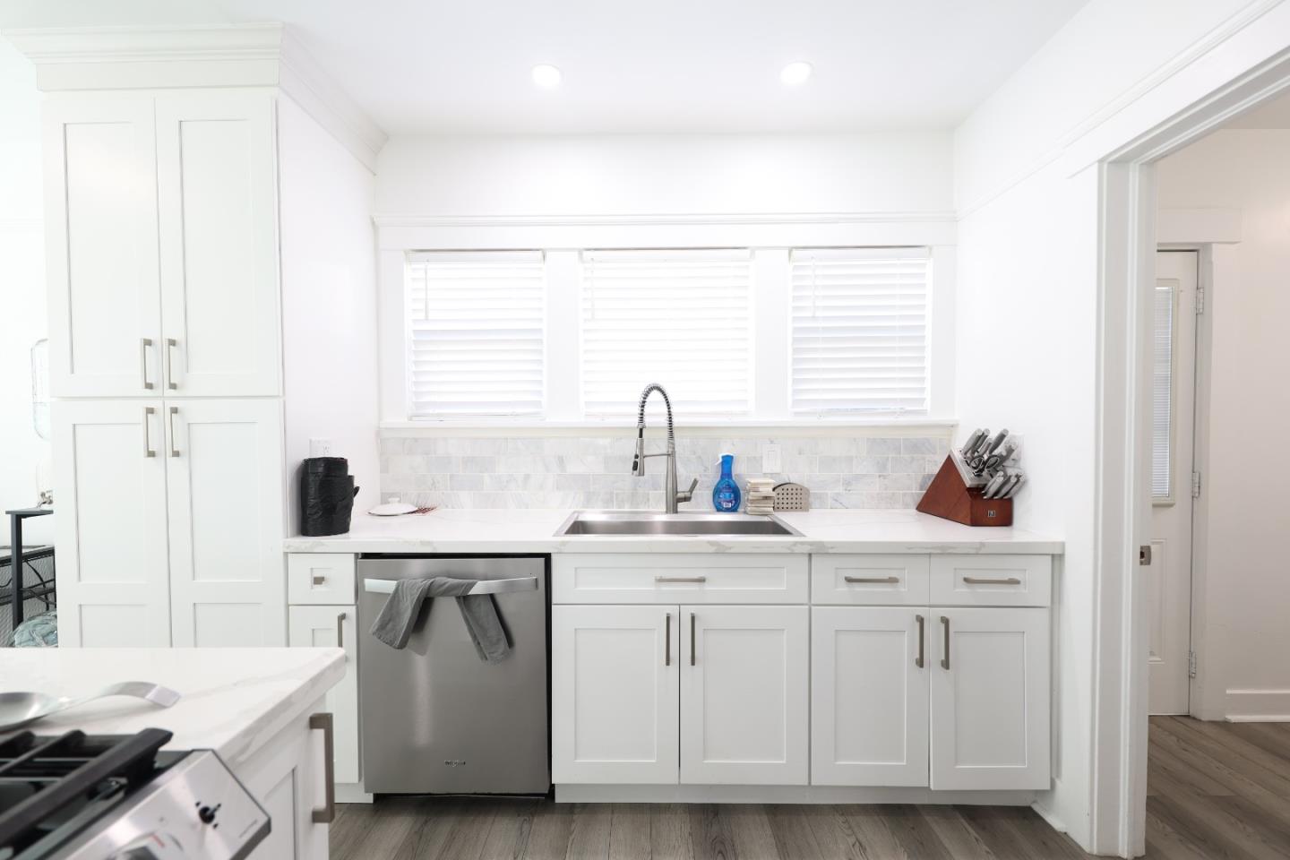 123 Chestnut Street Salinas, CA 93901 - Photo 8 of 25 a kitchen with white cabinets and sink