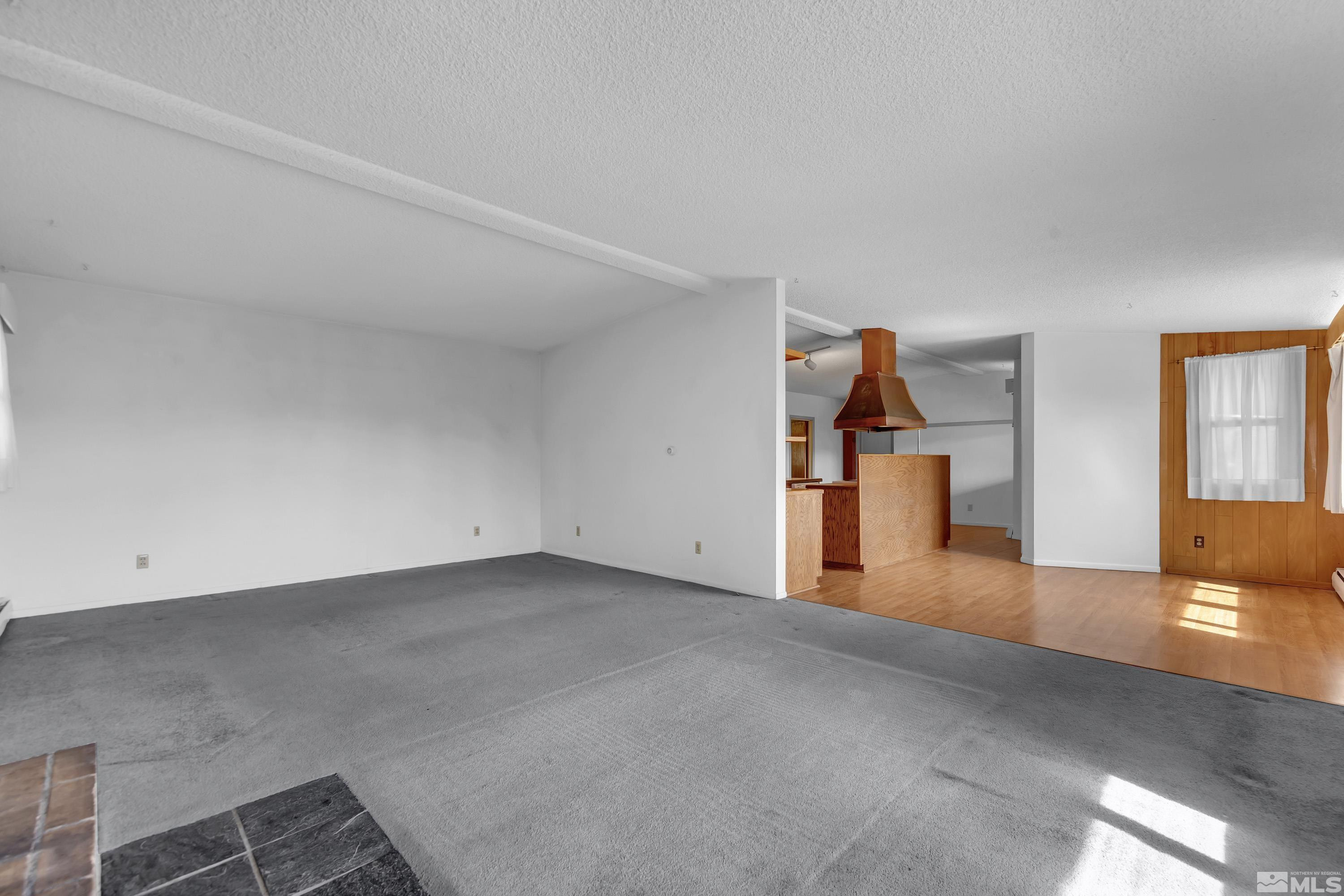 1275 Washington Street Reno, NV 89503 - Photo 12 of 37 an empty room with wooden floor and windows