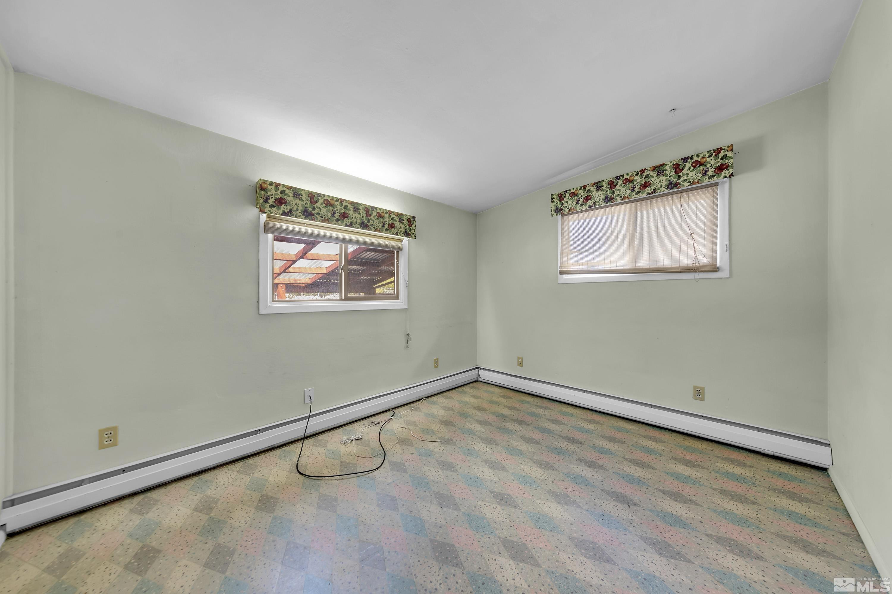 1275 Washington Street Reno, NV 89503 - Photo 16 of 37 an empty room with wooden floor and windows