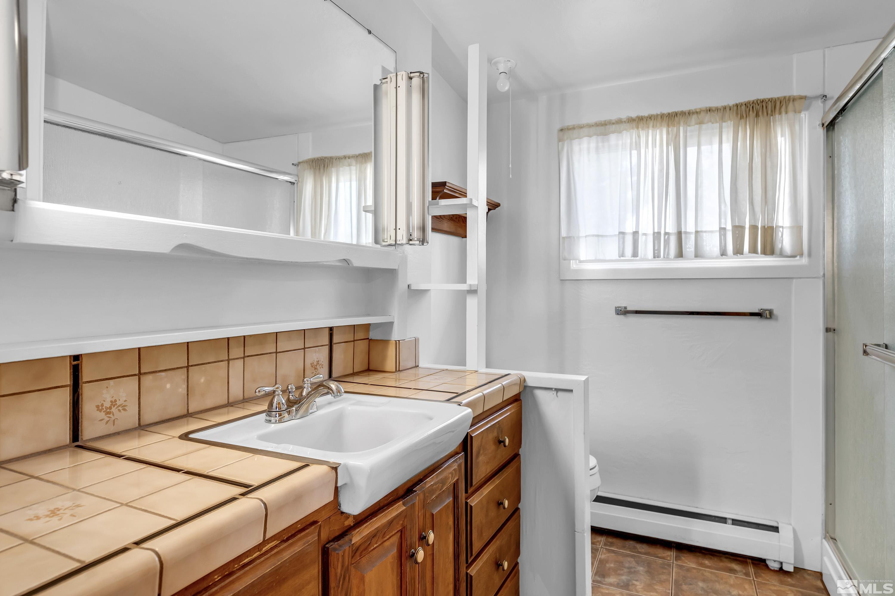 1275 Washington Street Reno, NV 89503 - Photo 19 of 37 a bathroom with a sink and a window