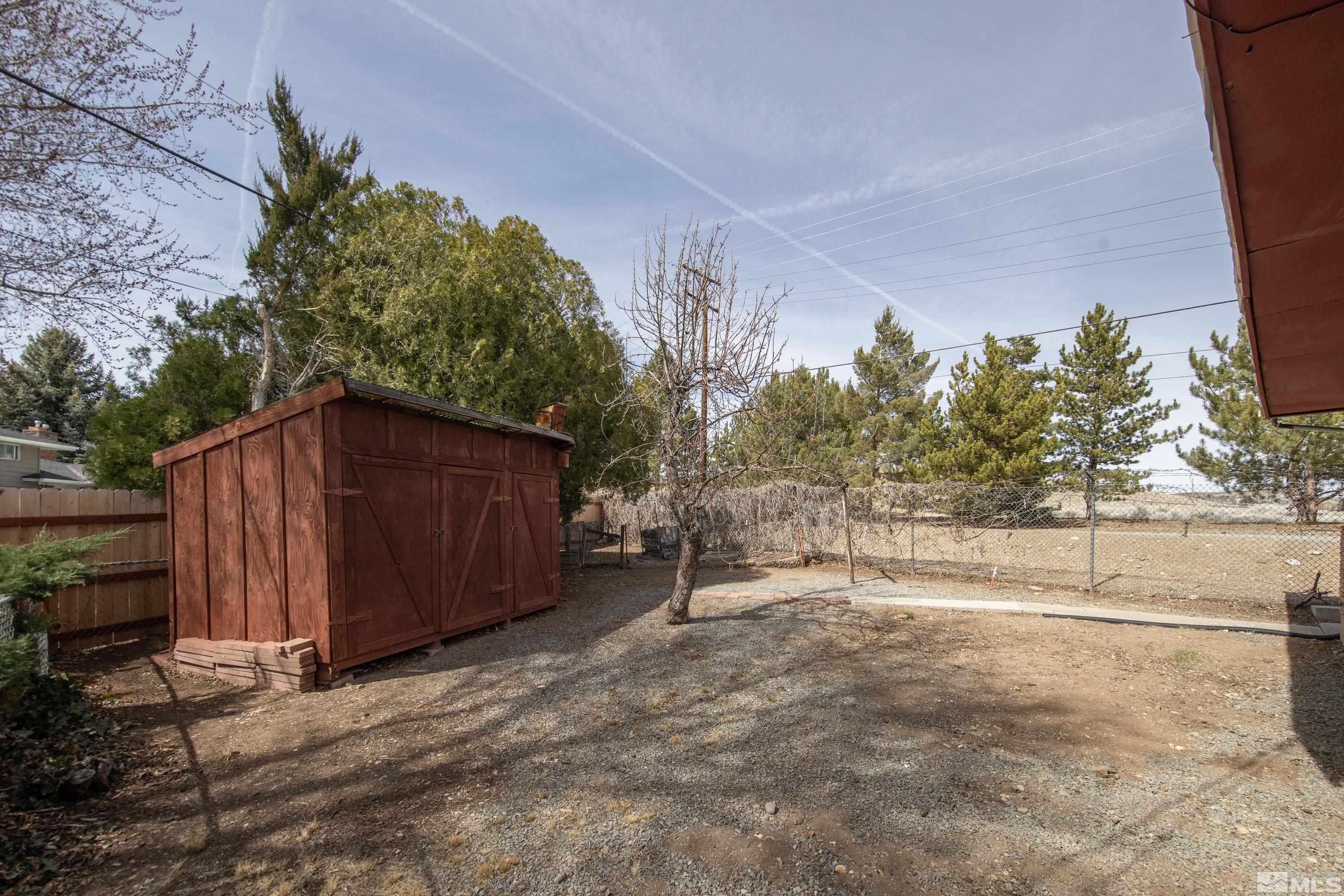 1275 Washington Street Reno, NV 89503 - Photo 30 of 37 a view of a backyard with wooden fence