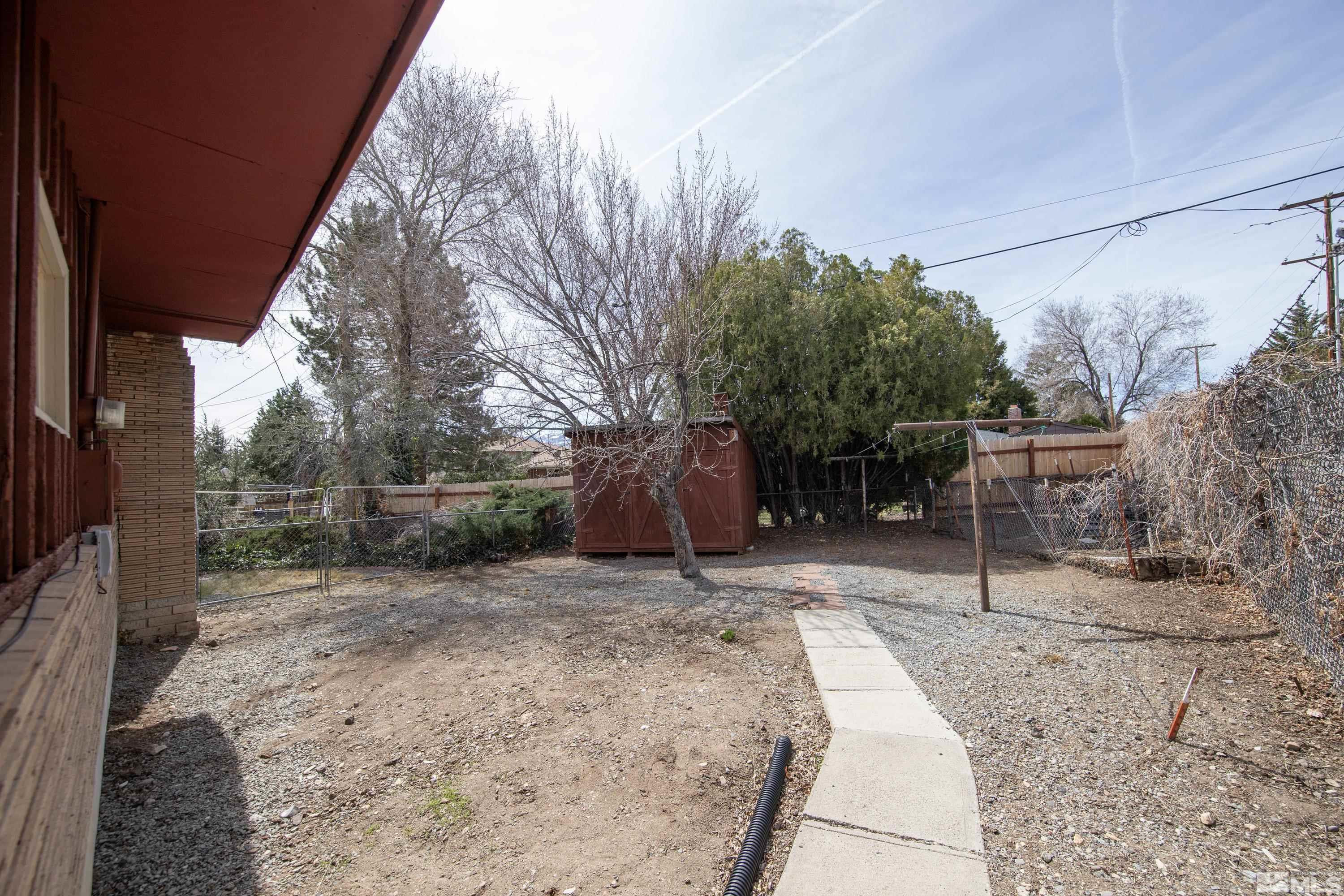 1275 Washington Street Reno, NV 89503 - Photo 31 of 37 a view of a backyard with wooden fence