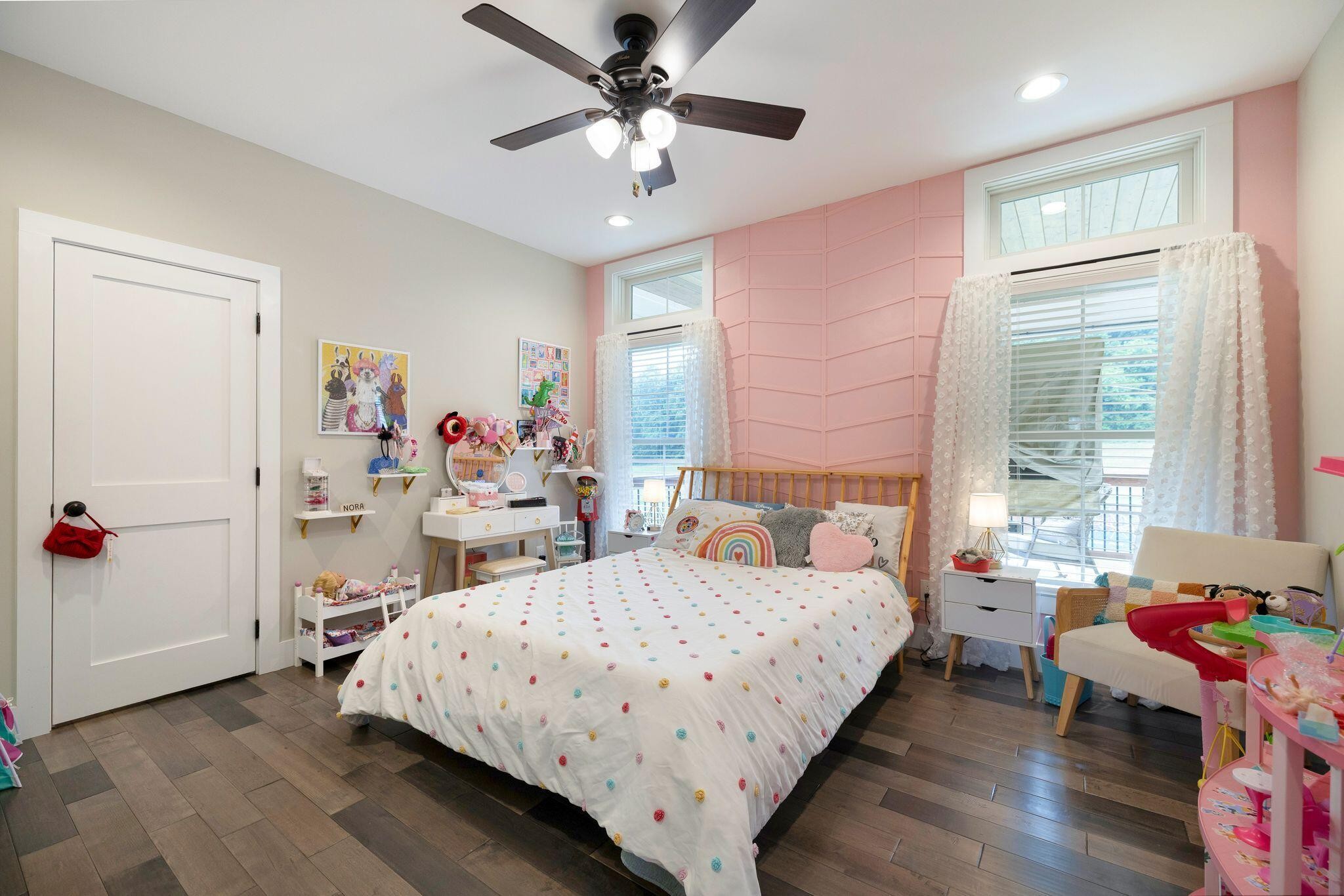 6866 Daus Mountain Road Whitwell, TN 37397 - Photo 17 of 49 a bedroom with a bed and a chandelier