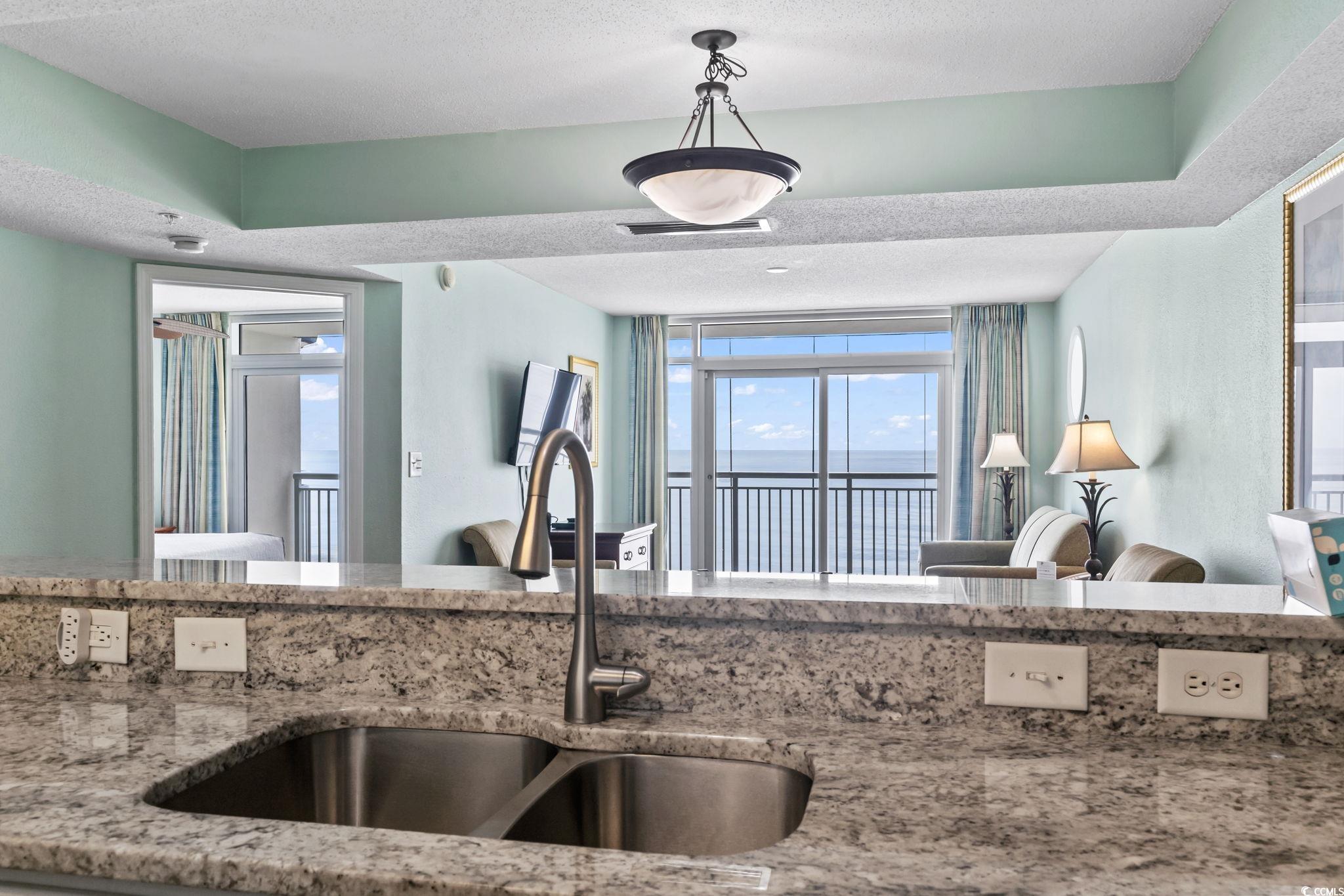2007 South Ocean Boulevard, Unit 607 Myrtle Beach, SC 29577 - Photo 18 of 40 Kitchen featuring a textured ceiling, visible vent