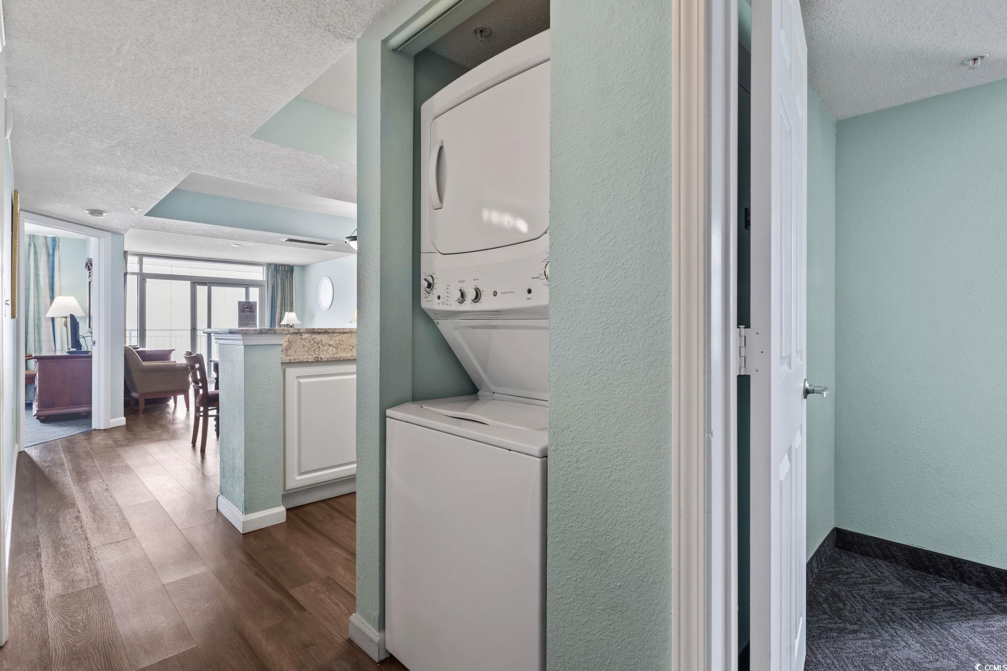 2007 South Ocean Boulevard, Unit 607 Myrtle Beach, SC 29577 - Photo 20 of 40 Washroom featuring stacked washer / drying machine