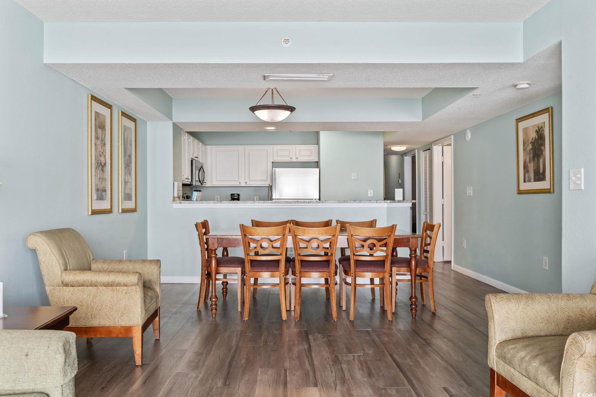 2007 South Ocean Boulevard, Unit 607 Myrtle Beach, SC 29577 - Photo 5 of 40 Dining space with baseboards and dark wood-style f