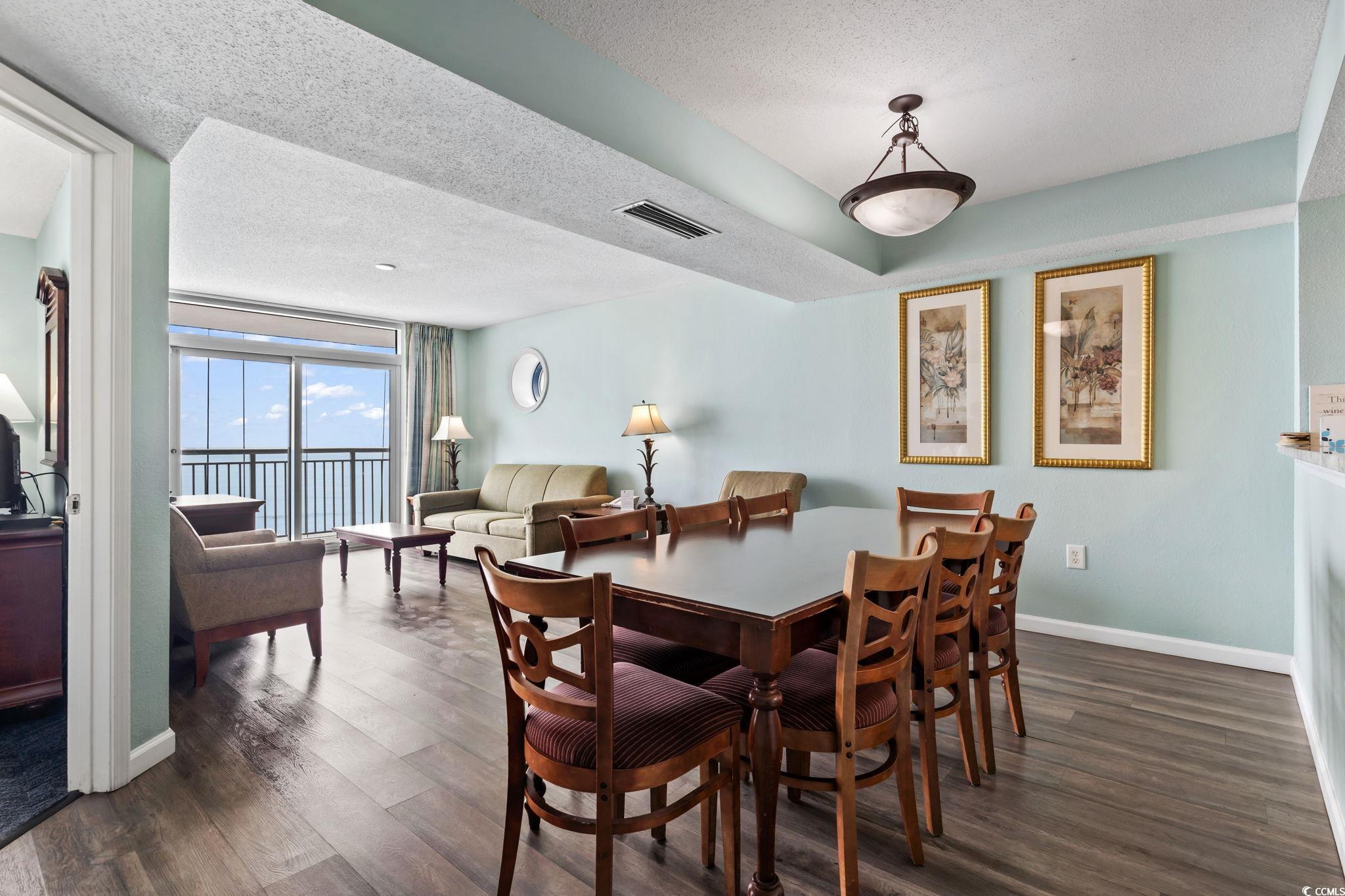 2007 South Ocean Boulevard, Unit 607 Myrtle Beach, SC 29577 - Photo 7 of 40 Dining area featuring baseboards, visible vents, d
