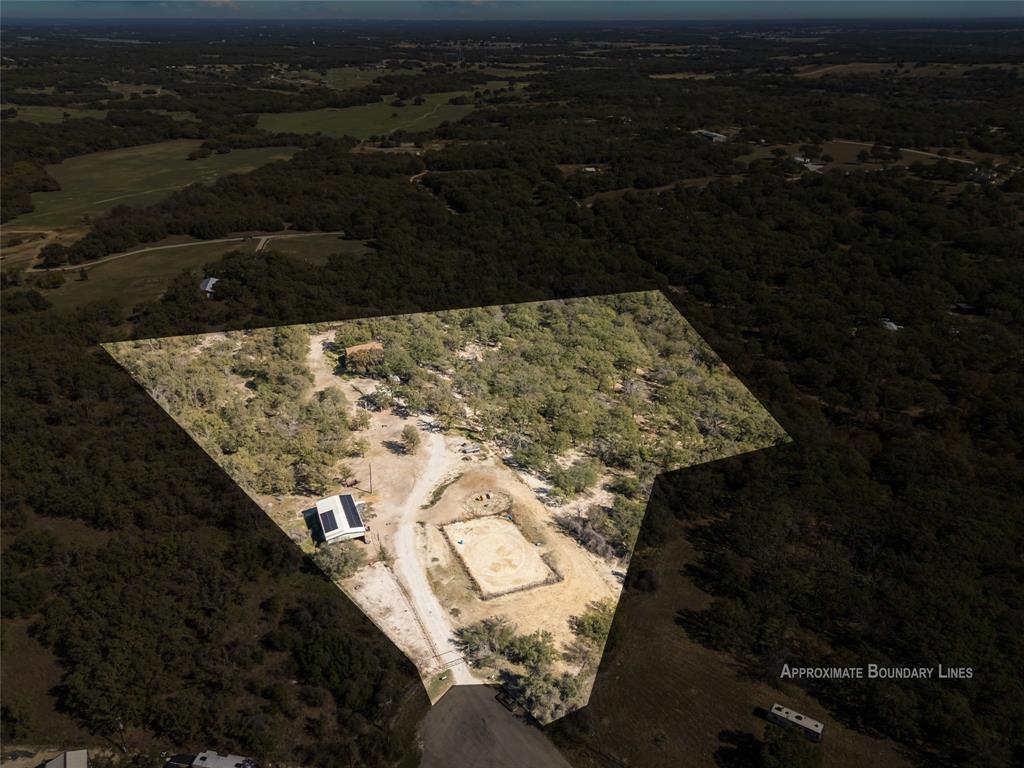 262 North Cheyenne Springtown, TX 76082 - Photo 3 of 35 Aerial view of property and surrounding area with a heavily wooded area