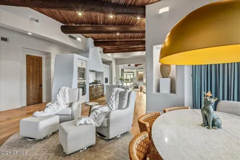 a bedroom with a bed couch and a mirror