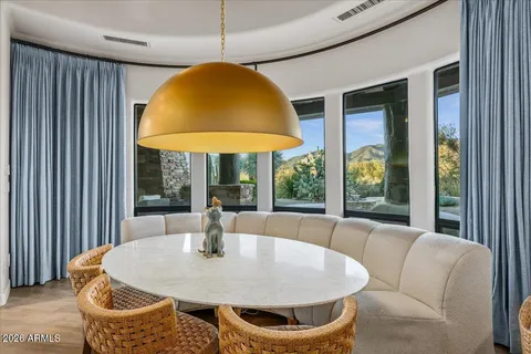 a spacious bedroom with a bed and a flat screen tv