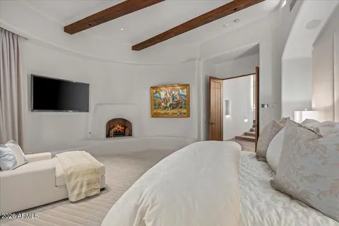 a view of a porch with furniture and floor to ceiling window