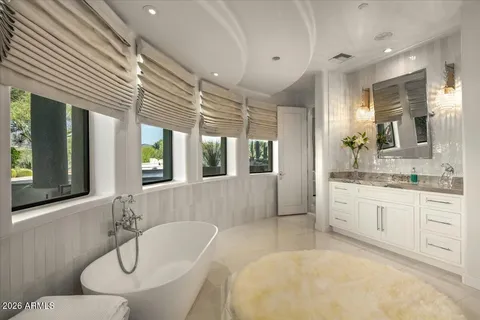 a view of a patio with table and chairs and potted plants