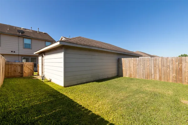 a view of a backyard of the house