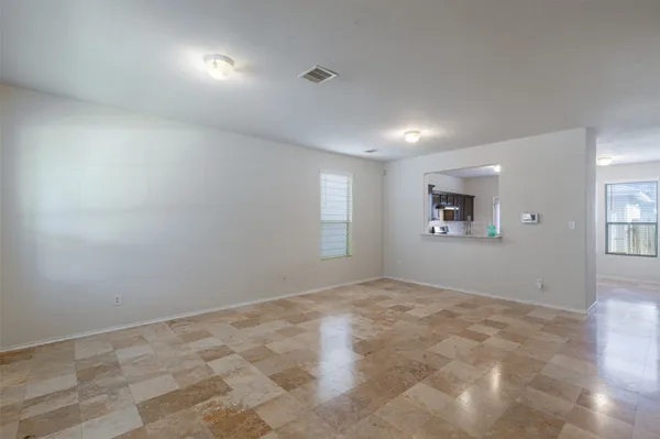 a view of an empty room and window