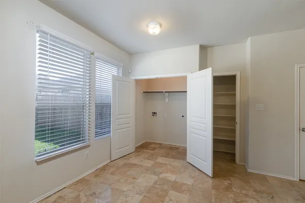 a view of an empty room with a window