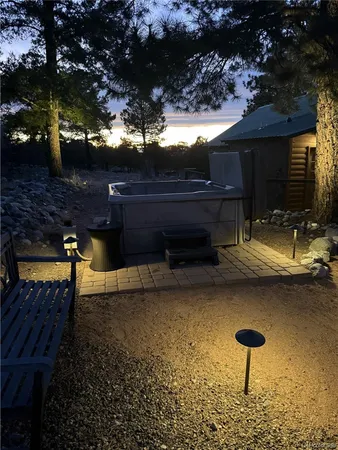 a view of a backyard with sitting area
