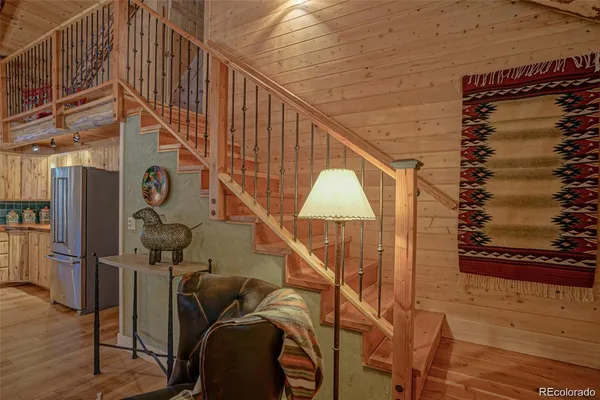a bedroom with a bed couch and window