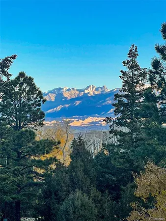 a view of a building with mountains in the background