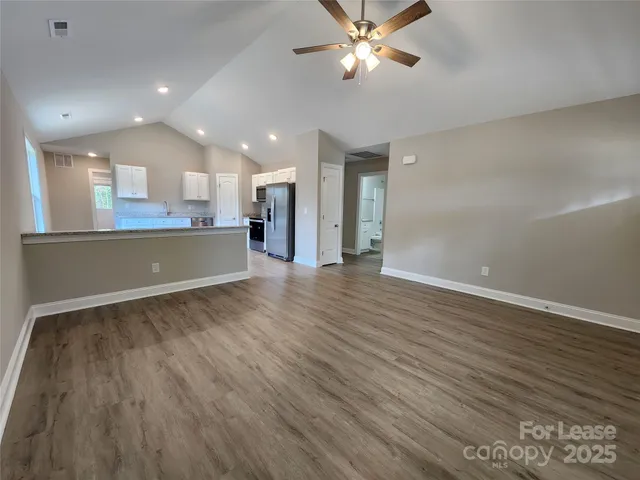 a view of a kitchen with a sink and microwave