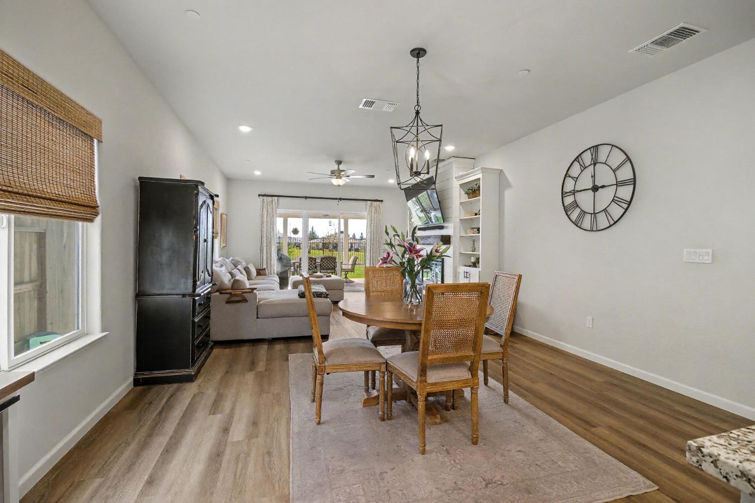 1502 Braeburn Way Ione, CA 95640 - Photo 11 of 48 a view of a dining room with furniture window and wooden floor