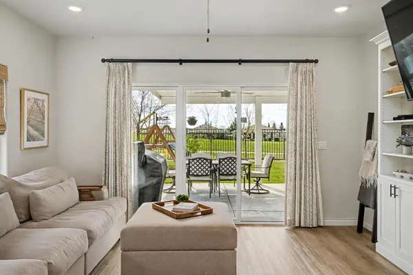 a living room with furniture and a large window
