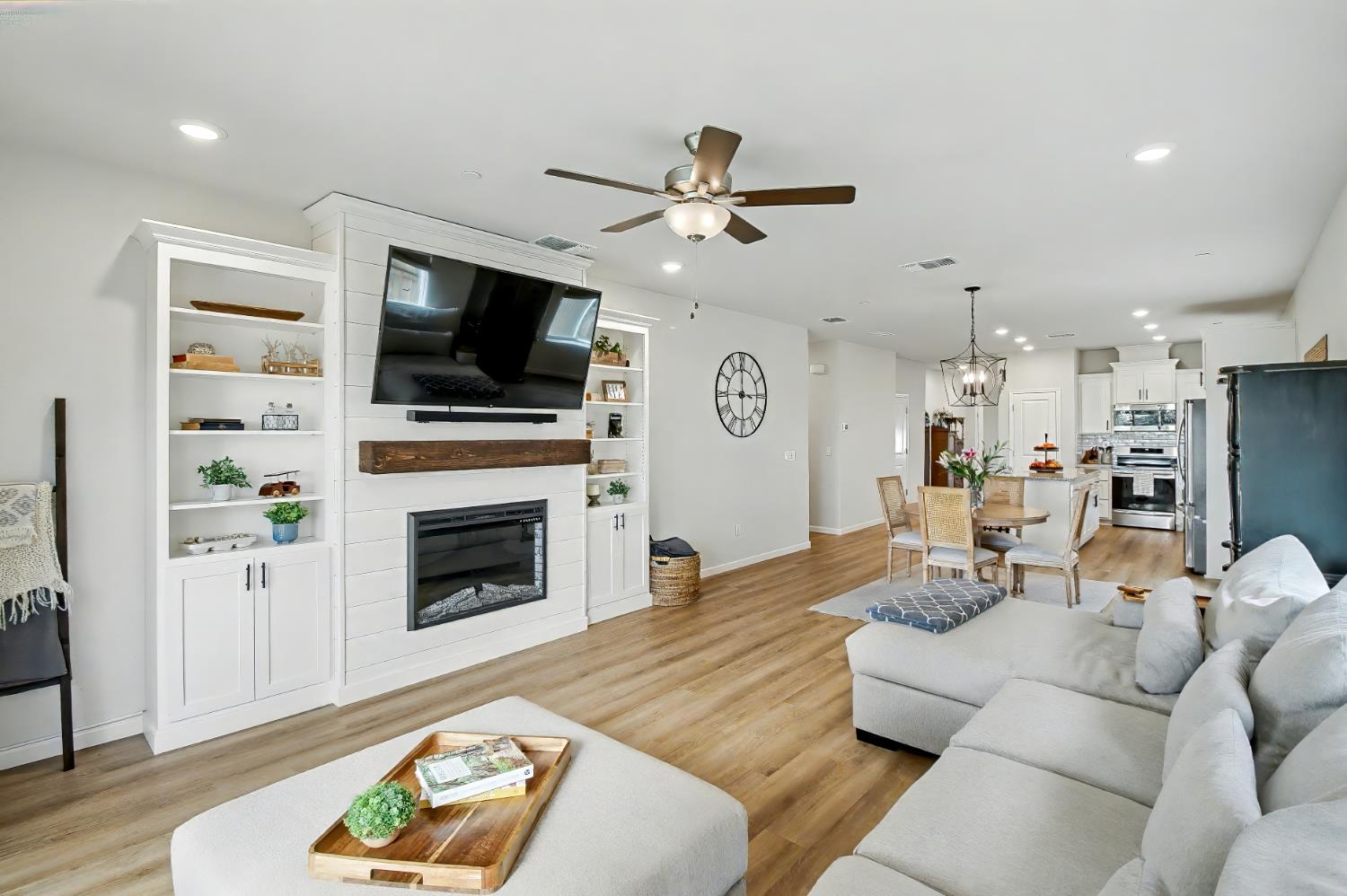1502 Braeburn Way Ione, CA 95640 - Photo 16 of 48 a living room with furniture a flat screen tv and a fireplace
