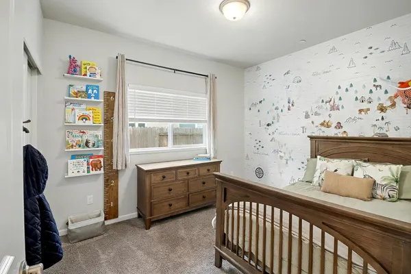 a bedroom with bed and a window