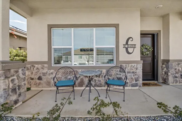 a living room filled with furniture and a window