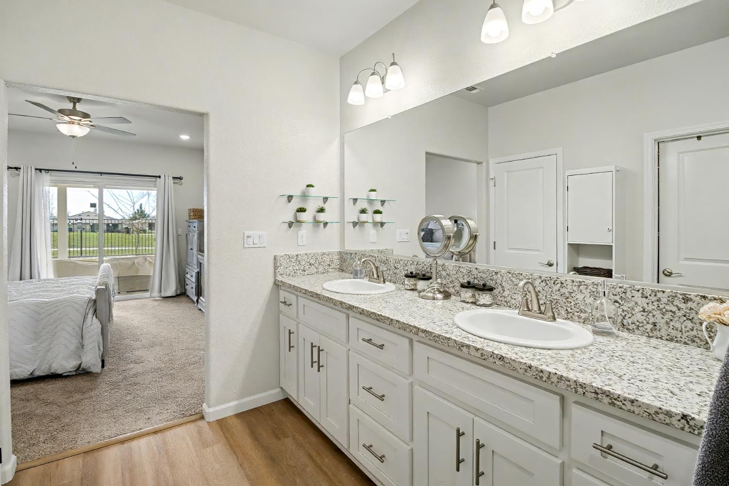 1502 Braeburn Way Ione, CA 95640 - Photo 37 of 48 a en suite bathroom with double vanity and a mirror