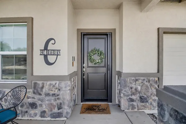 a front view of a house with garden