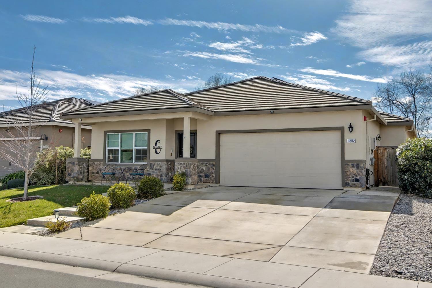1502 Braeburn Way Ione, CA 95640 - Photo 47 of 48 a front view of a house with a garden