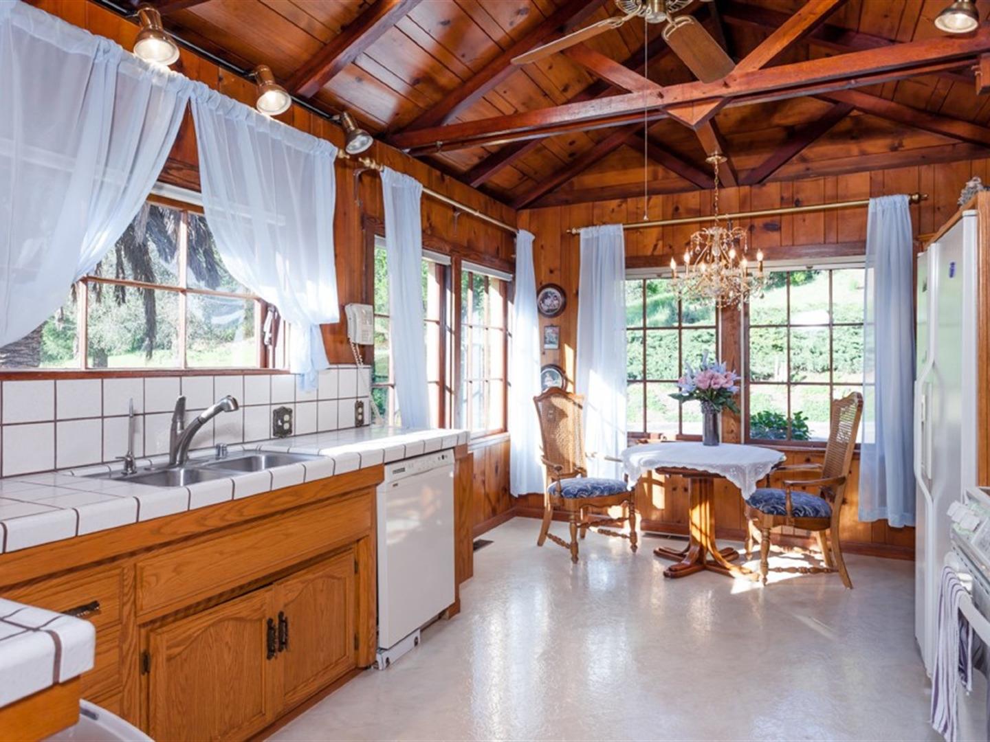 7550 Whitehurst Road Gilroy, CA 95020 - Photo 12 of 49 a view of a kitchen with a sink and dishwasher next to a window