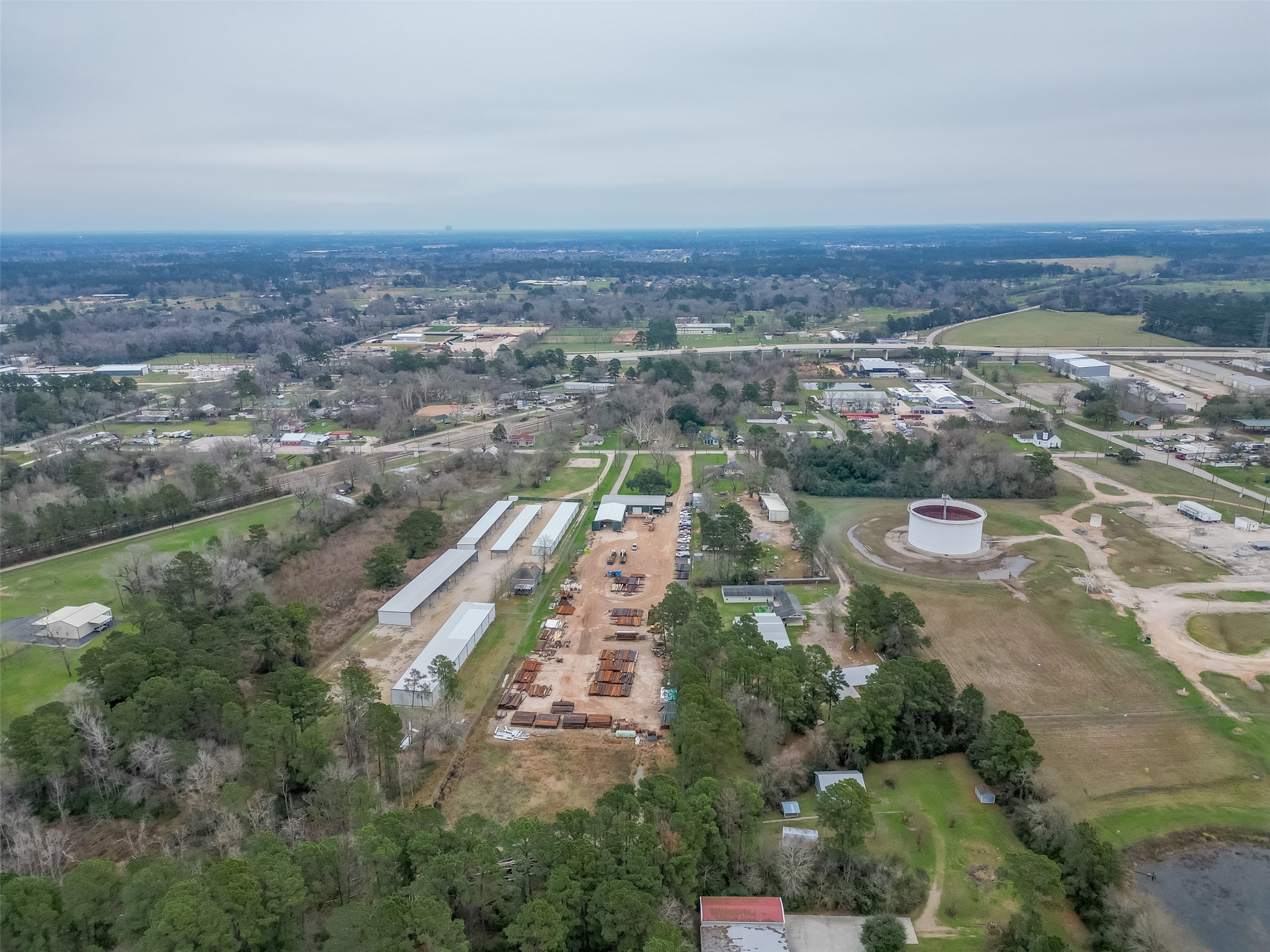 12122 Zion Road Tomball, TX 77375 - Photo 34 of 35 an aerial view of residential house and lake view