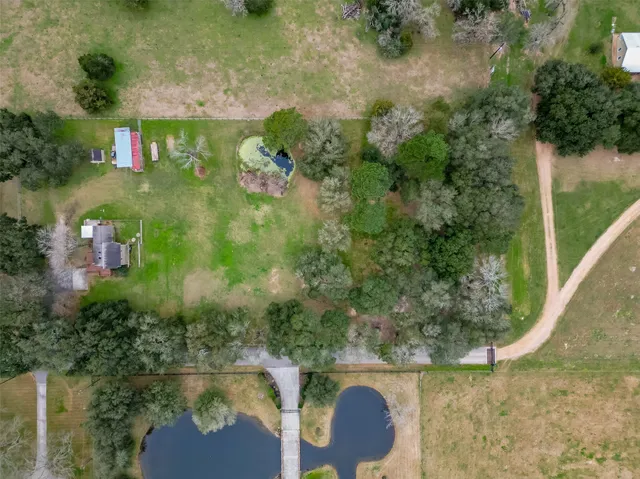 an aerial view of a house yard and outdoor seating