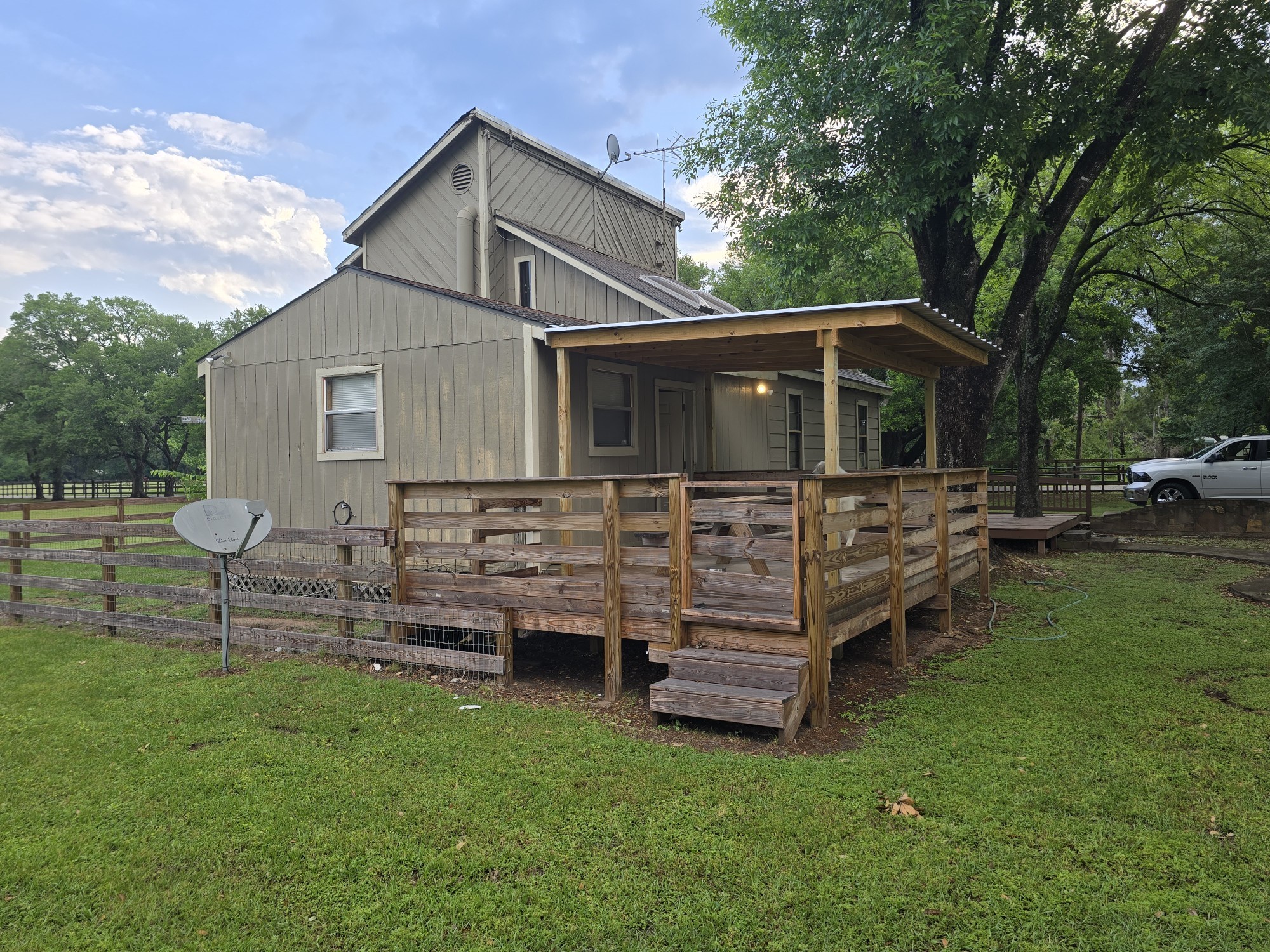12122 Zion Road Tomball, TX 77375 - Photo 10 of 35 a front view of a house with a yard table and chairs
